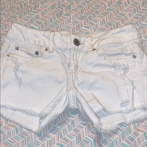 These are a pair of white American eagle shorts.